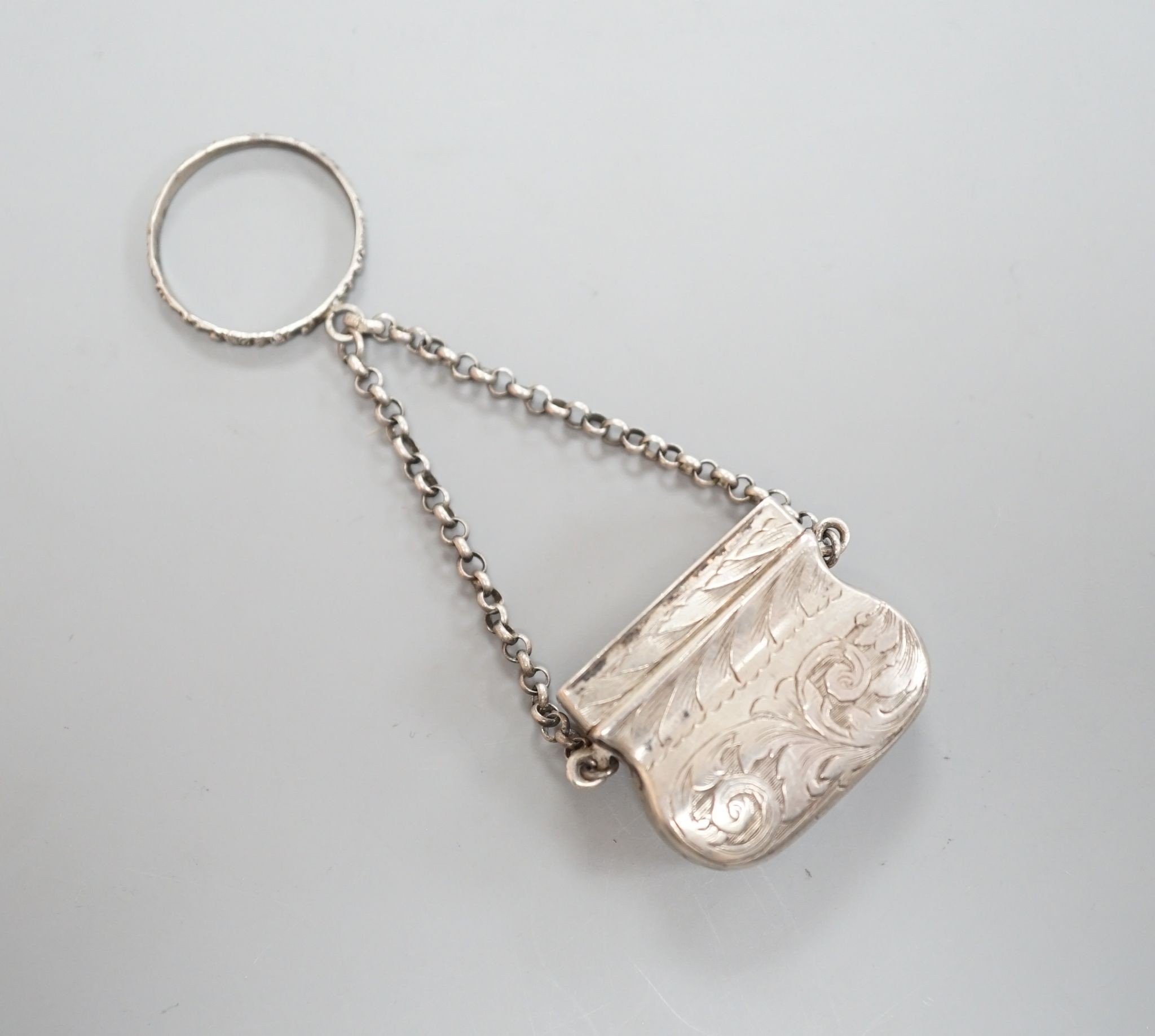 A Victorian novelty silver vinaigrette, modelled as a handbag, John Tongue, Birmingham, circa, 1840 (date letter rubbed), width 27mm.